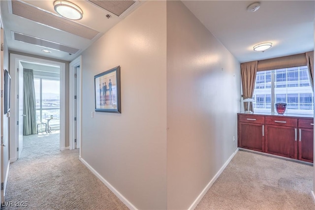 4575 Dean Martin Dr Unit 1112, Las Vegas, NV 89103 - hallway with light carpet and plenty of natural light