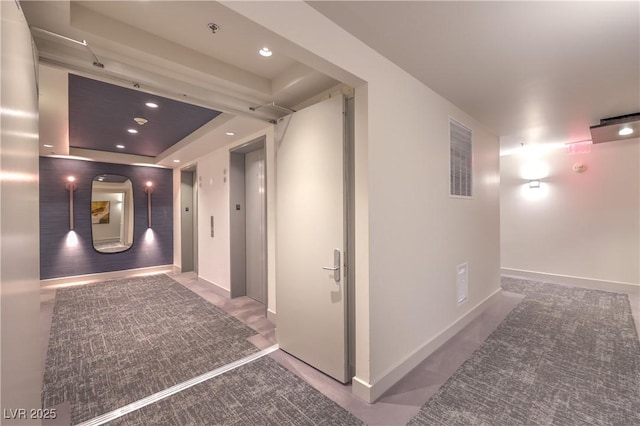 4575 Dean Martin Dr Unit 1112, Las Vegas, NV 89103 - hallway with a raised ceiling, elevator, and recessed lighting