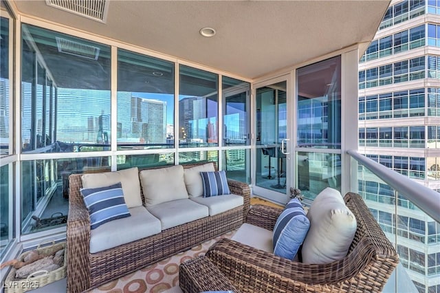 4575 Dean Martin Dr Unit 1112, Las Vegas, NV 89103 - sunroom / solarium with an outdoor living space, healthy amount of natural light, and a city view