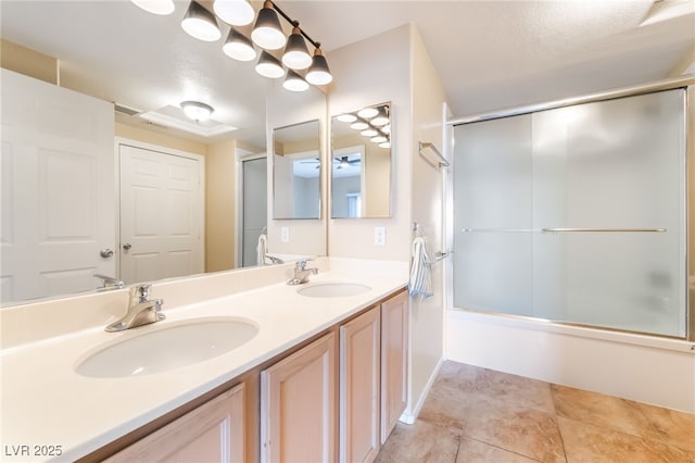 7450 S Eastern Ave Unit 1058, Las Vegas, NV 89123 - bathroom with combined bath / shower with glass door, double vanity, and tile patterned flooring