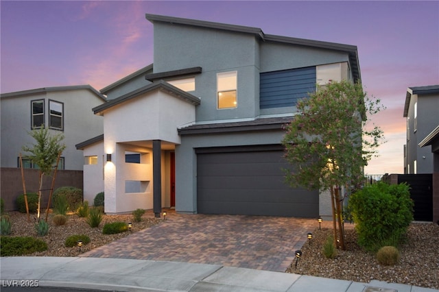 2004 Peaceful Mesa Ct, Henderson, NV 89052 - modern home featuring stucco siding, an attached garage, and decorative driveway