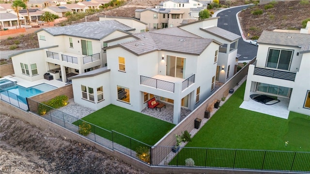 2004 Peaceful Mesa Ct, Henderson, NV 89052 - rear view of house with a balcony, a fenced backyard, stucco siding, a patio, and a residential view