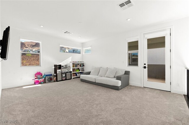 2004 Peaceful Mesa Ct, Henderson, NV 89052 - living room featuring carpet flooring, plenty of natural light, and recessed lighting