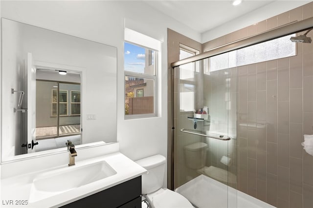 2004 Peaceful Mesa Ct, Henderson, NV 89052 - bathroom featuring healthy amount of natural light, a shower stall, and vanity
