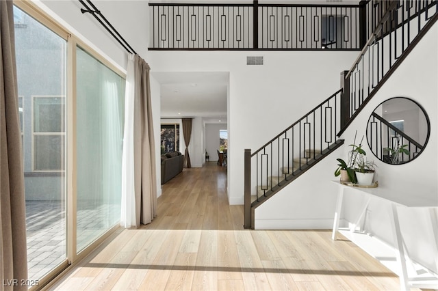 2004 Peaceful Mesa Ct, Henderson, NV 89052 - foyer featuring wood finished floors, stairs, and a high ceiling