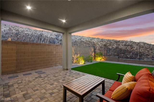 2004 Peaceful Mesa Ct, Henderson, NV 89052 - patio terrace at dusk featuring a patio and a fenced backyard