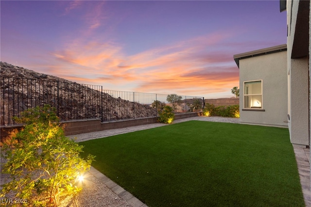 2004 Peaceful Mesa Ct, Henderson, NV 89052 - yard at dusk featuring a fenced backyard