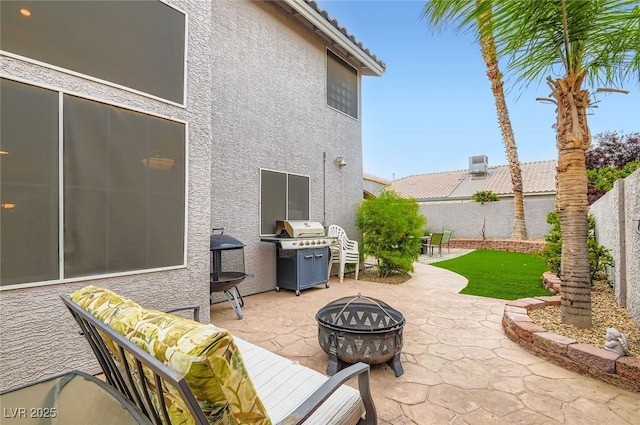 1325 Baychester Dr, Henderson, NV 89002 - fenced backyard with an outdoor fire pit, a patio, and grilling area