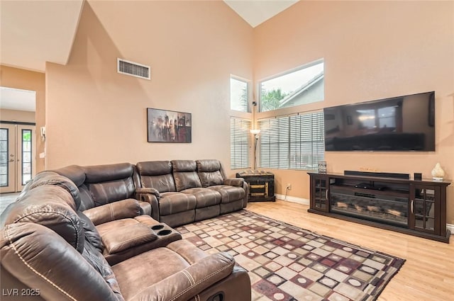 1325 Baychester Dr, Henderson, NV 89002 - living area with high vaulted ceiling and wood finished floors