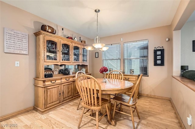 1325 Baychester Dr, Henderson, NV 89002 - dining area with light wood-style flooring and baseboards