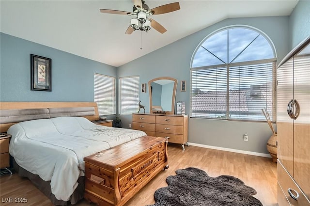 1325 Baychester Dr, Henderson, NV 89002 - bedroom with vaulted ceiling, light wood-style flooring, and ceiling fan