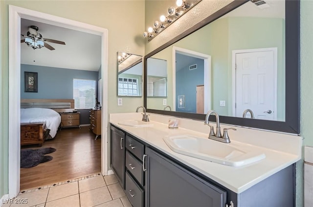 1325 Baychester Dr, Henderson, NV 89002 - ensuite bathroom featuring double vanity, ceiling fan, and tile patterned floors