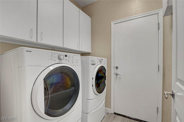 3544 Tack St, Las Vegas, NV 89122 - laundry room featuring independent washer and dryer, cabinet space, and light wood finished floors