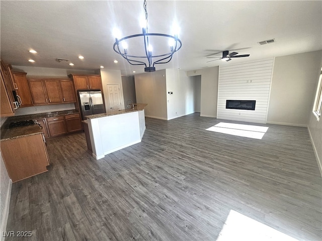 3544 Tack St, Las Vegas, NV 89122 - kitchen with appliances with stainless steel finishes, recessed lighting, a ceiling fan, open floor plan, and brown cabinets