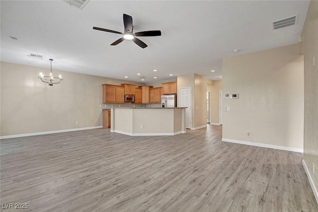 3544 Tack St, Las Vegas, NV 89122 - unfurnished living room with ceiling fan, light wood-type flooring, a chandelier, and recessed lighting