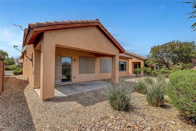 3544 Tack St, Las Vegas, NV 89122 - back of house featuring stucco siding and a patio