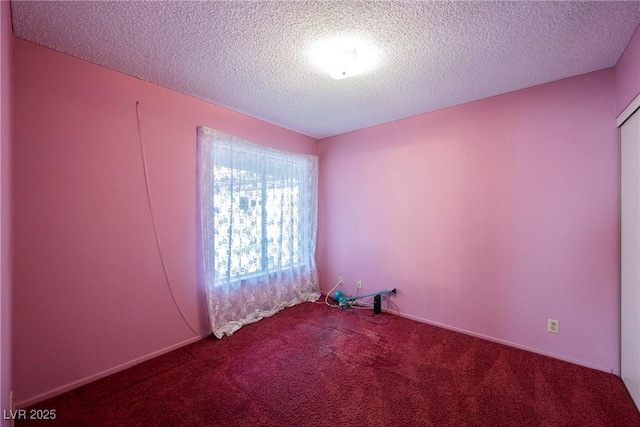 6513 Hyde Ave, Las Vegas, NV 89107 - spare room featuring carpet floors and a textured ceiling