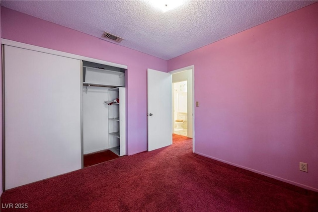 6513 Hyde Ave, Las Vegas, NV 89107 - unfurnished bedroom featuring carpet, a closet, and a textured ceiling