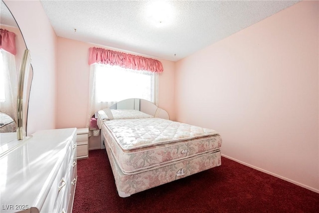 6513 Hyde Ave, Las Vegas, NV 89107 - bedroom with dark colored carpet and a textured ceiling