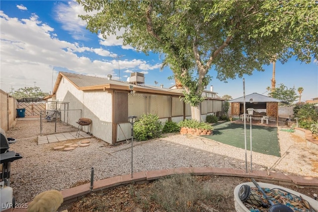 6513 Hyde Ave, Las Vegas, NV 89107 - rear view of property with a fenced backyard, a patio area, and a gate