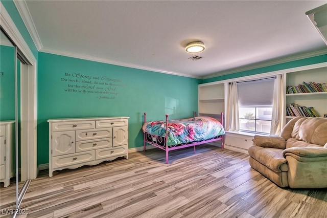 3525 Dover Bay St, Las Vegas, NV 89129 - bedroom with crown molding, light wood-style flooring, and a closet