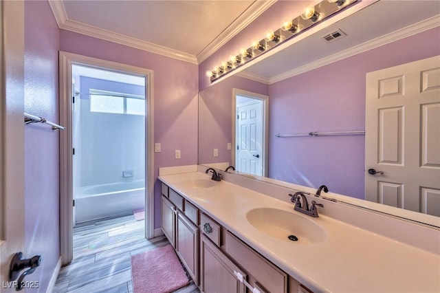 3525 Dover Bay St, Las Vegas, NV 89129 - bathroom with double vanity, crown molding, wood finished floors, and shower / washtub combination