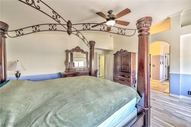 3525 Dover Bay St, Las Vegas, NV 89129 - bedroom with arched walkways, wood finished floors, and ceiling fan