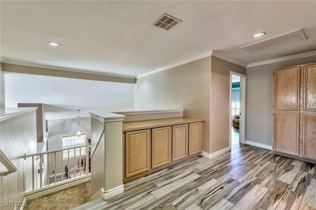 3525 Dover Bay St, Las Vegas, NV 89129 - hall with an upstairs landing, light wood-style floors, crown molding, recessed lighting, and plenty of natural light
