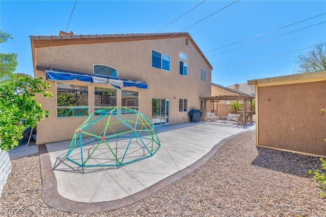 3525 Dover Bay St, Las Vegas, NV 89129 - rear view of house with a pergola, a patio, and stucco siding