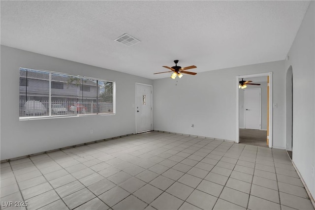 75 N 27th St, Las Vegas, NV 89101 - spare room with a ceiling fan, a textured ceiling, and arched walkways