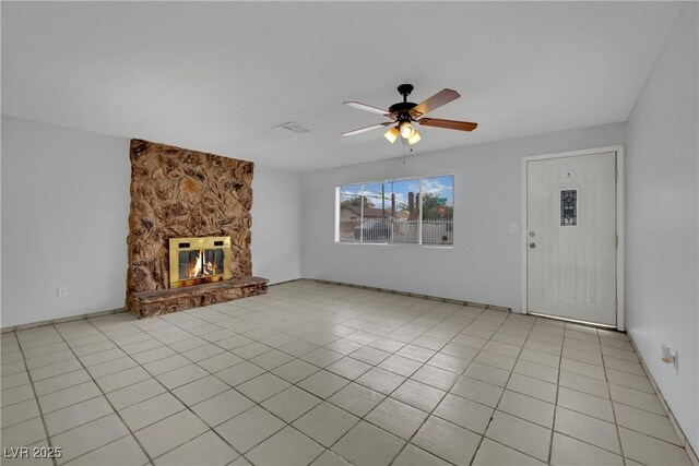 75 N 27th St, Las Vegas, NV 89101 - unfurnished living room with ceiling fan, a fireplace, and light tile patterned floors