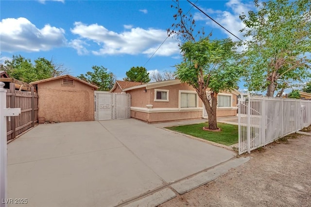 75 N 27th St, Las Vegas, NV 89101 - view of front of home with a gate and stucco siding