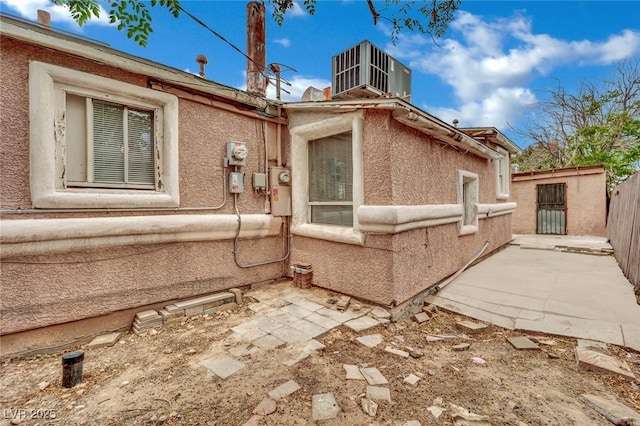 75 N 27th St, Las Vegas, NV 89101 - view of property exterior with stucco siding and a patio area