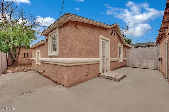 75 N 27th St, Las Vegas, NV 89101 - view of side of property featuring a patio area and stucco siding