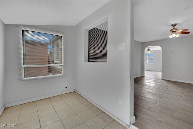 75 N 27th St, Las Vegas, NV 89101 - unfurnished room with ceiling fan, arched walkways, and light wood-style floors