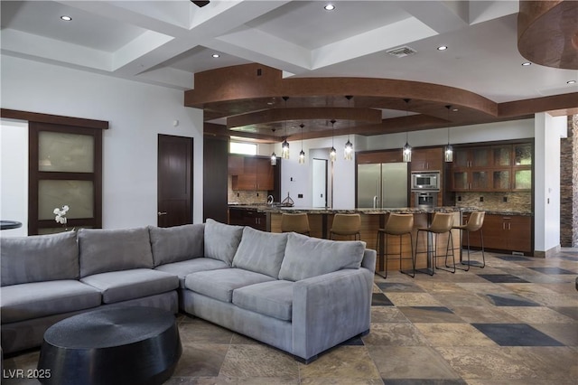 17 Soaring Bird Ct, Las Vegas, NV 89135 - living area featuring beam ceiling, coffered ceiling, recessed lighting, and dark stone finish flooring