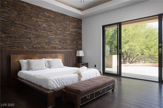 17 Soaring Bird Ct, Las Vegas, NV 89135 - bedroom with access to exterior, wood finished floors, and a tray ceiling