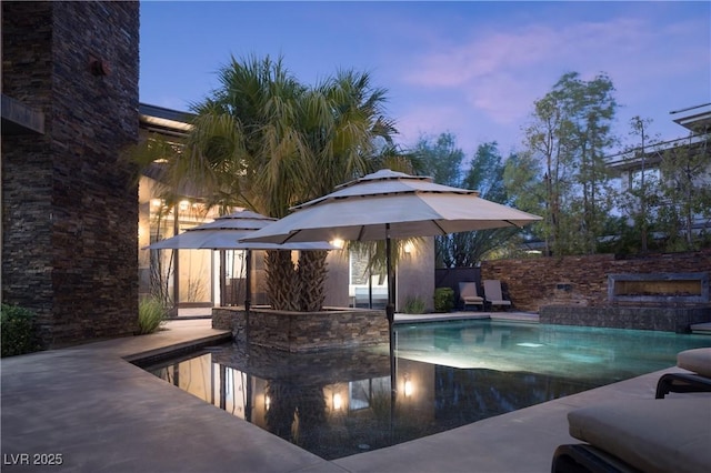 17 Soaring Bird Ct, Las Vegas, NV 89135 - pool at dusk with an outdoor pool
