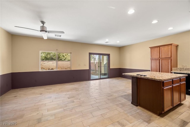 5338 Lignum Ave, Pahrump, NV 89061 - kitchen with open floor plan, healthy amount of natural light, a ceiling fan, a center island, and recessed lighting