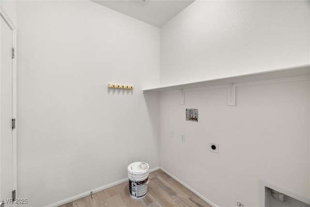 5338 Lignum Ave, Pahrump, NV 89061 - laundry area featuring hookup for a washing machine, light wood-type flooring, and electric dryer hookup