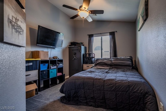 5028 Crying Heart St, North Las Vegas, NV 89031 - carpeted bedroom featuring vaulted ceiling, a ceiling fan, and a textured wall