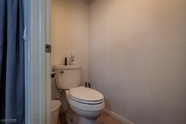 5028 Crying Heart St, North Las Vegas, NV 89031 - bathroom with baseboards and tile patterned floors