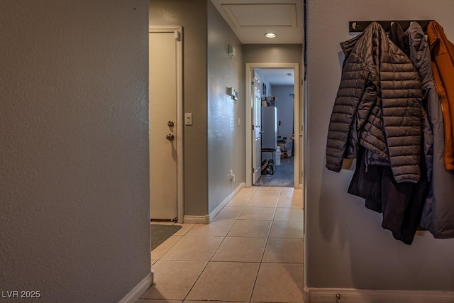 5028 Crying Heart St, North Las Vegas, NV 89031 - hallway featuring light tile patterned floors and attic access