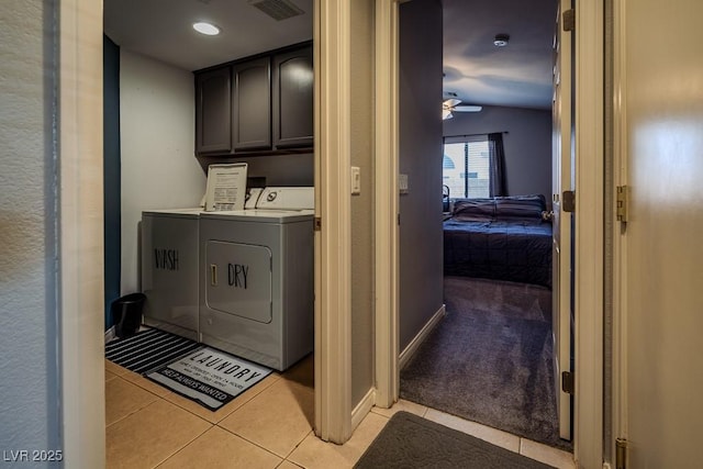 5028 Crying Heart St, North Las Vegas, NV 89031 - laundry room with washer and dryer, cabinet space, light tile patterned floors, ceiling fan, and light carpet