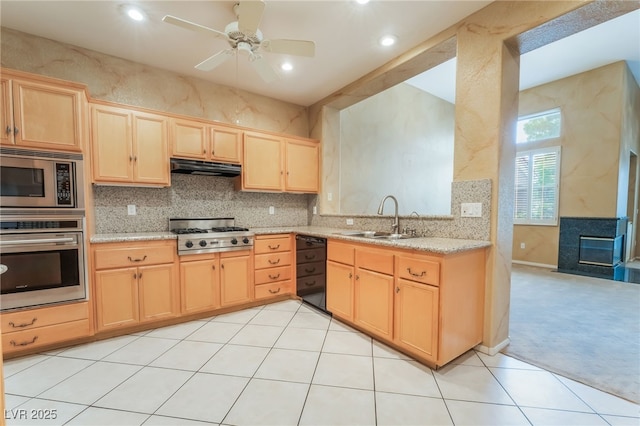 10037 Summer Oak Ln Unit 102, Las Vegas, NV 89134 - kitchen with appliances with stainless steel finishes, light brown cabinets, under cabinet range hood, decorative backsplash, and a ceiling fan
