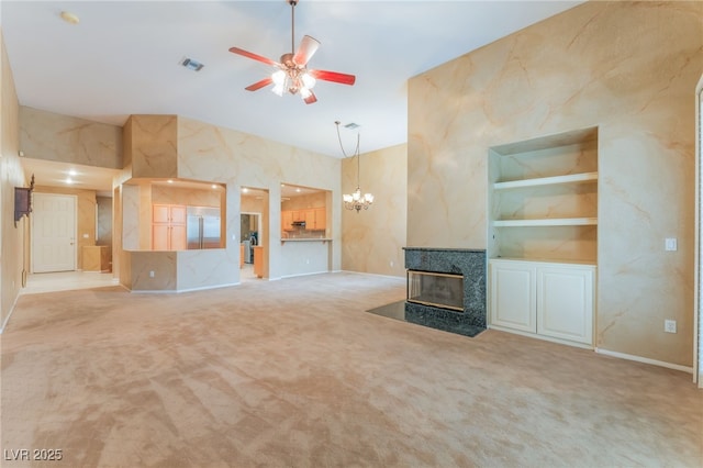 10037 Summer Oak Ln Unit 102, Las Vegas, NV 89134 - unfurnished living room featuring ceiling fan, a multi sided fireplace, vaulted ceiling, a chandelier, and carpet