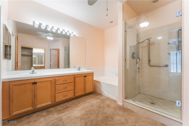 10037 Summer Oak Ln Unit 102, Las Vegas, NV 89134 - bathroom featuring a ceiling fan, a shower stall, double vanity, and a garden tub