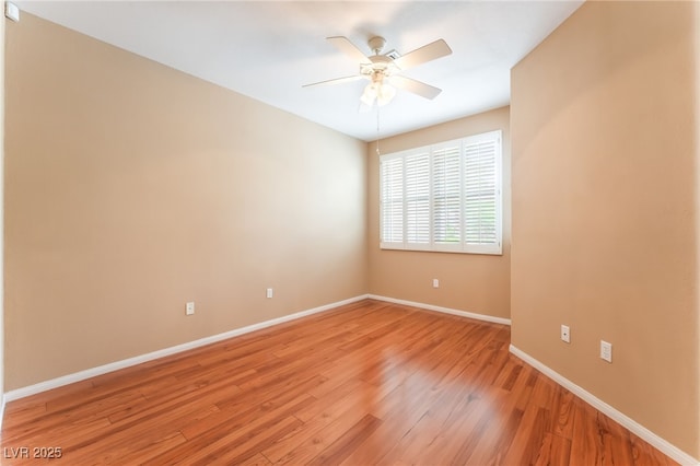 10037 Summer Oak Ln Unit 102, Las Vegas, NV 89134 - empty room with a ceiling fan and light wood-style floors