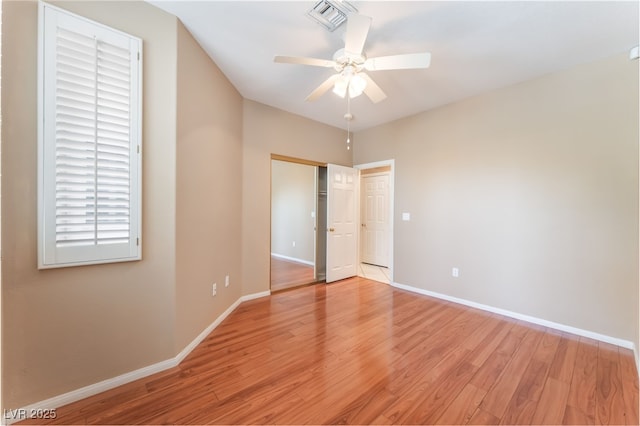 10037 Summer Oak Ln Unit 102, Las Vegas, NV 89134 - unfurnished bedroom featuring light wood-style flooring, ceiling fan, and a closet