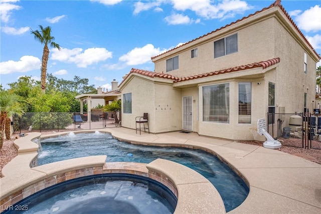 2010 Catalina Marie Ave, Henderson, NV 89074 - view of pool featuring a fenced backyard, a pool with connected hot tub, and a patio area